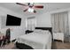 This comfortable bedroom features a ceiling fan and dresser, offering storage space at 4078 Winding Vine Dr, Lakeland, FL 33812