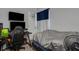 Bedroom featuring an organized gaming desk and a bed with stylish grey blanket with blue accents at 4078 Winding Vine Dr, Lakeland, FL 33812