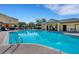 Large community pool with patio seating areas and view of neighborhood amenities at 4078 Winding Vine Dr, Lakeland, FL 33812