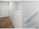 This hallway has neutral carpet and leads to another room at 4078 Winding Vine Dr, Lakeland, FL 33812