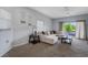 Spacious living room boasts plush carpet, neutral tones, and abundant natural light at 4078 Winding Vine Dr, Lakeland, FL 33812