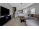 Spacious living room with stairs to upper level and access to kitchen at 4078 Winding Vine Dr, Lakeland, FL 33812