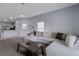 Open living room with views of the kitchen and comfortable sectional sofa at 4078 Winding Vine Dr, Lakeland, FL 33812