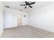Neutral bedroom with carpet, ceiling fan, and walk-in closet provides a serene and comfortable space at 4203 San Rocco Way, Winter Haven, FL 33884