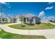 A gray single-Gathering home is presented with a green lawn and white fence at 4203 San Rocco Way, Winter Haven, FL 33884