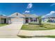 Inviting single-Gathering home with a well-maintained lawn, two-car garage, and decorative shutters at 4203 San Rocco Way, Winter Haven, FL 33884
