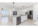 Modern kitchen features granite countertops, stainless steel appliances, and a center island with pendant lighting at 4203 San Rocco Way, Winter Haven, FL 33884