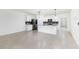 Modern kitchen featuring an island, stainless steel appliances, and an open layout with tile flooring at 4203 San Rocco Way, Winter Haven, FL 33884