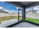 Screened lanai with outdoor patio with views of fenced backyard at 4203 San Rocco Way, Winter Haven, FL 33884