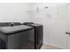 Laundry area features modern black washer and dryer at 4203 San Rocco Way, Winter Haven, FL 33884