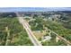 Aerial view of the property, nestled amongst a private collection of trees in the surrounding landscape at 4540 Park Ave, Indian Lake Estates, FL 33855