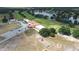 An aerial view of the golf course, lake, and ample parking spaces at 4540 Park Ave, Indian Lake Estates, FL 33855