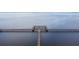 Expansive wooden pier stretching out into the serene, calm water, offering scenic views and recreational opportunities at 4540 Park Ave, Indian Lake Estates, FL 33855