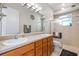 Bathroom featuring a double sink vanity, and a stand-alone shower at 4540 Park Ave, Indian Lake Estates, FL 33855