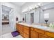 Bathroom boasts double sinks, spacious vanity, and well-lit mirror at 4540 Park Ave, Indian Lake Estates, FL 33855