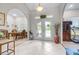 Grand foyer with tile flooring, arched doorways, and elegant glass paneled double doors at 4540 Park Ave, Indian Lake Estates, FL 33855