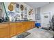 Garage featuring a sink, counter, fishing-rod rack, and decorated walls at 4540 Park Ave, Indian Lake Estates, FL 33855