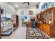 Spacious home office with built-in shelving, neutral carpet, and ample natural light at 4540 Park Ave, Indian Lake Estates, FL 33855