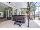 Covered hot tub area on the patio, offering a relaxing retreat with easy access to indoor amenities at 4540 Park Ave, Indian Lake Estates, FL 33855
