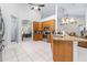 Spacious kitchen featuring stainless steel appliances, granite countertops, and tiled flooring at 4540 Park Ave, Indian Lake Estates, FL 33855