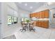 Bright eat-in kitchen with pool view, tiled flooring, and ample natural light at 4540 Park Ave, Indian Lake Estates, FL 33855