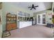 Outdoor patio featuring storage, cabinetry and counter, with a ceiling fan, and a nearby exit at 4540 Park Ave, Indian Lake Estates, FL 33855