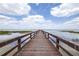 Beautiful view of the pier on the lake, showcasing both it's length and surrounding areas at 4540 Park Ave, Indian Lake Estates, FL 33855