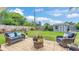 Serene backyard featuring a patio area and lush landscaping at 4965 Tradition Dr, Lakeland, FL 33812