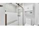 A newly remodeled bathroom featuring a glass shower and white fixtures at 4965 Tradition Dr, Lakeland, FL 33812