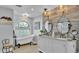 Charming bathroom boasting a vintage soaking tub, dual vanities, and stylish decor at 4965 Tradition Dr, Lakeland, FL 33812