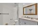 A minimalist bathroom with a stone vanity and a large framed mirror at 4965 Tradition Dr, Lakeland, FL 33812