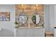 Elegant bathroom featuring dual sinks, granite countertops, and decorative wood accents at 4965 Tradition Dr, Lakeland, FL 33812
