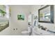Well-lit half bathroom with a decorative mirror and stylish fixtures at 4965 Tradition Dr, Lakeland, FL 33812