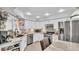 Bright kitchen featuring granite counters, stainless appliances, and white cabinets, perfect for modern cooking and entertaining at 4965 Tradition Dr, Lakeland, FL 33812