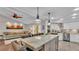 Beautiful eat-in kitchen featuring a large island, granite counters and seamless flow to the living area at 4965 Tradition Dr, Lakeland, FL 33812