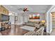 Inviting living room boasting hardwood floors, neutral decor, and a seamless transition to other living spaces at 4965 Tradition Dr, Lakeland, FL 33812