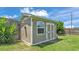 Outdoor shed featuring a window, double doors and a 'Ruby St' sign at 4965 Tradition Dr, Lakeland, FL 33812