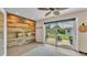 The sunroom features a wood accent wall and a view to the backyard at 4965 Tradition Dr, Lakeland, FL 33812