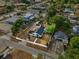 An aerial view showcasing the home's layout, detached garage, and surrounding fenced yard at 522 Channing Rd, Lakeland, FL 33805