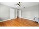 An empty bedroom featuring hardwood floors and a modern ceiling fan at 522 Channing Rd, Lakeland, FL 33805