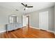 Bedroom with hardwood floors and a dresser and mirror at 522 Channing Rd, Lakeland, FL 33805