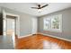 Bedroom featuring hardwood floors, a ceiling fan, and windows with lots of natural light at 522 Channing Rd, Lakeland, FL 33805
