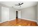 An empty bedroom featuring beautiful hardwood floors and a modern ceiling fan at 522 Channing Rd, Lakeland, FL 33805