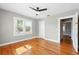 Light, airy bedroom featuring hardwood floors and natural light at 522 Channing Rd, Lakeland, FL 33805
