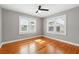 An empty bedroom featuring beautiful hardwood floors and natural light from the windows at 522 Channing Rd, Lakeland, FL 33805