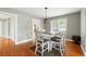 Cozy dining area with hardwood floors, a stylish light fixture, and a view into the living room at 522 Channing Rd, Lakeland, FL 33805