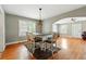 Bright dining room offering hardwood floors, a statement light, and seamless flow to living spaces at 522 Channing Rd, Lakeland, FL 33805