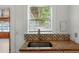 Kitchen featuring granite counters and patterned backsplash at 522 Channing Rd, Lakeland, FL 33805