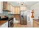 Bright kitchen featuring stainless steel appliances and decorative tile backsplash at 522 Channing Rd, Lakeland, FL 33805