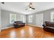 Inviting living room with shining hardwood floors, natural light, and neutral wall color at 522 Channing Rd, Lakeland, FL 33805